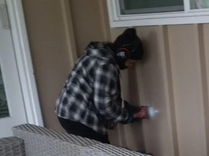 Professional electrician installing an exterior outlet in Willowbrook