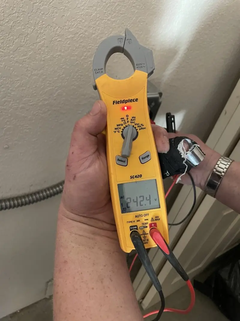 Voltage testing with clamp meter during Generator Installation in Willowbrook